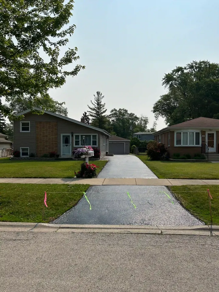 Straight residential driveway with a cord across the entrance